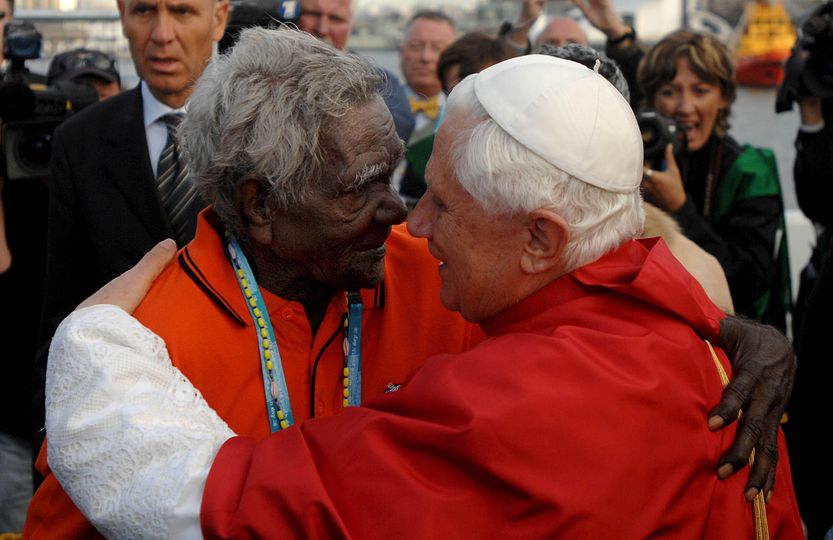 Image of late Pope Eeremitus Benedict XVI embracing Deacon Boniface Perdjert. The use of Deacon Boniface’s image has been approved for publication in Catholic media by his family.